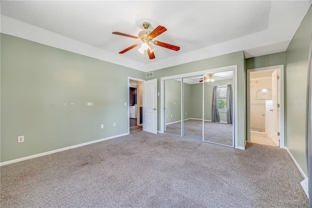 160 SW 131st Hwy, Holden, MO 64040 - unfurnished bedroom featuring carpet, a closet, a ceiling fan, and connected bathroom