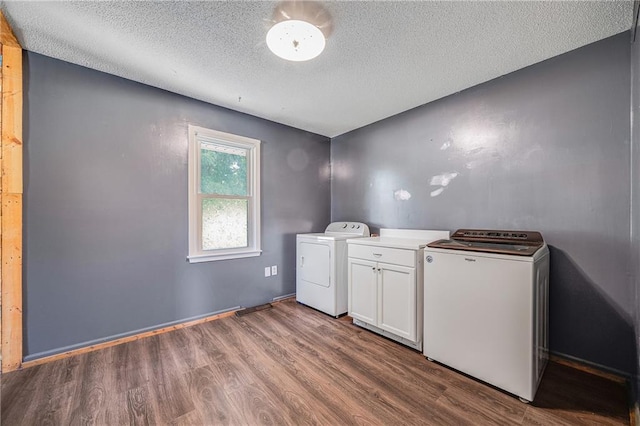 160 SW 131st Hwy, Holden, MO 64040 - washroom with independent washer and dryer, wood finished floors, a textured ceiling, and cabinet space