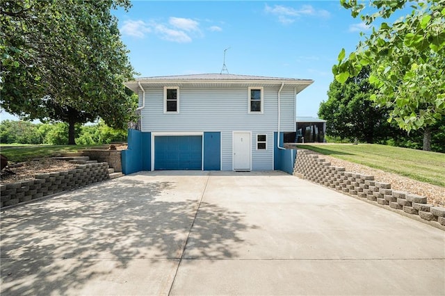 160 SW 131st Hwy, Holden, MO 64040 - view of property exterior with driveway, an attached garage, and a lawn