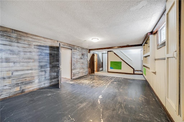 160 SW 131st Hwy, Holden, MO 64040 - unfurnished living room with wooden walls and a textured ceiling