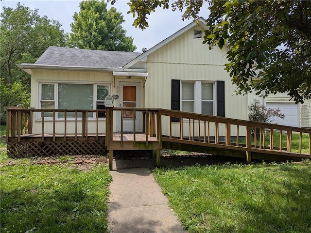 225 E 11th St, Horton, KS 66439 - view of front of home with a shingled roof and a wooden deck