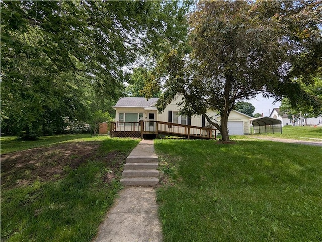 225 E 11th St, Horton, KS 66439 - view of front of property with a front yard, a deck, and a carport