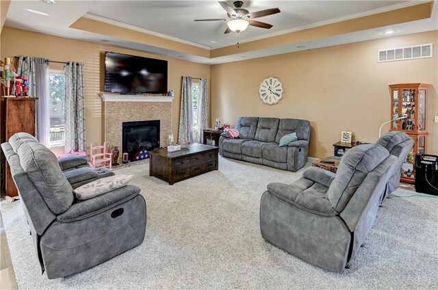 966 Moore Pl, Odessa, MO 64076 - living room with carpet, crown molding, a tray ceiling, ceiling fan, and healthy amount of natural light