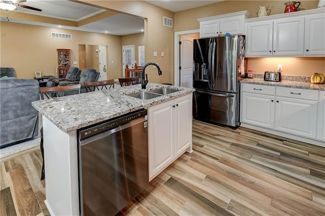 966 Moore Pl, Odessa, MO 64076 - kitchen with fridge with ice dispenser, dishwasher, open floor plan, light wood finished floors, and recessed lighting