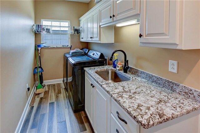 966 Moore Pl, Odessa, MO 64076 - laundry area with cabinet space, independent washer and dryer, and dark wood-style floors