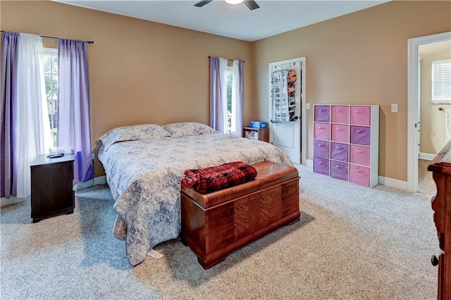 966 Moore Pl, Odessa, MO 64076 - bedroom featuring multiple windows, carpet floors, and a ceiling fan