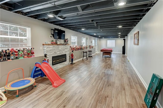 966 Moore Pl, Odessa, MO 64076 - playroom featuring wood finished floors, billiards table, and a stone fireplace