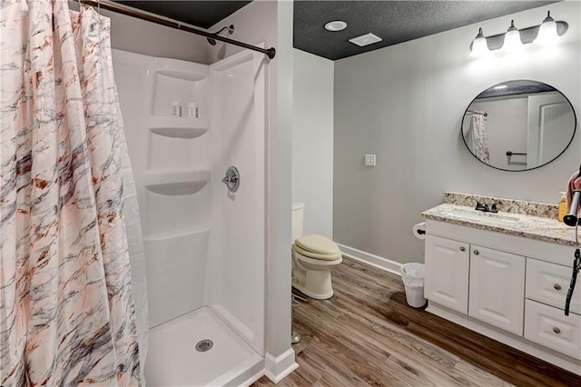 966 Moore Pl, Odessa, MO 64076 - full bathroom with vanity, wood finished floors, a shower with curtain, and a textured ceiling