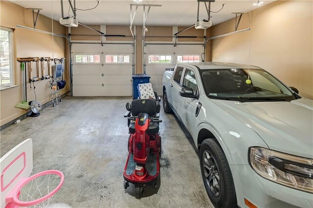 966 Moore Pl, Odessa, MO 64076 - garage featuring a garage door opener