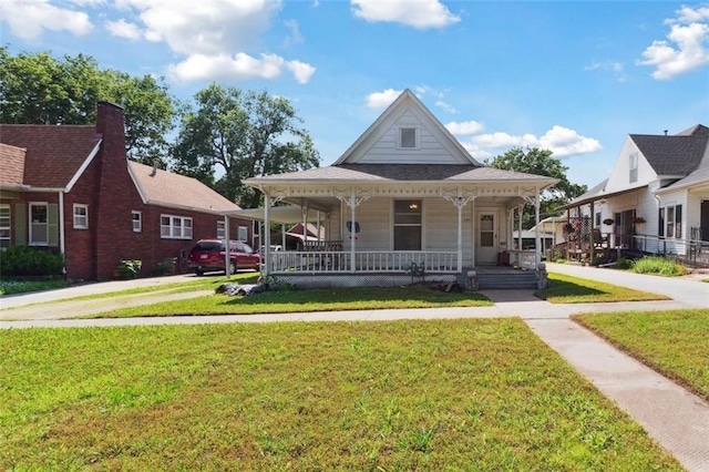 201 N Steuben Ave, Chanute, KS 66720 - farmhouse featuring covered porch and a front yard