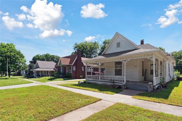 201 N Steuben Ave, Chanute, KS 66720 - view of front of home featuring a porch and a front yard