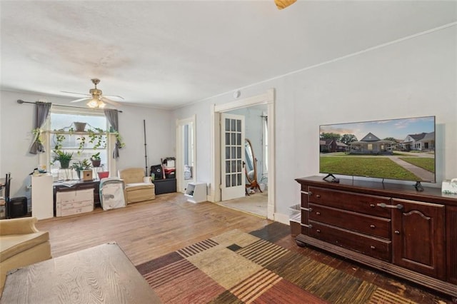 201 N Steuben Ave, Chanute, KS 66720 - living room with wood finished floors, a ceiling fan, and french doors