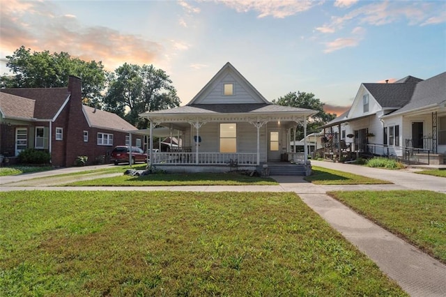 201 N Steuben Ave, Chanute, KS 66720 - view of front of property featuring a porch and a front yard