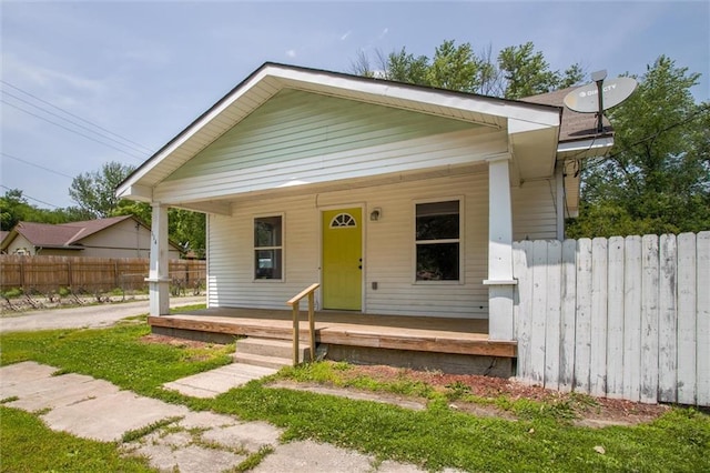 114 W 2nd St, Garden City, MO 64747 - bungalow-style house with covered porch