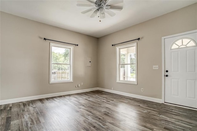 114 W 2nd St, Garden City, MO 64747 - foyer entrance featuring plenty of natural light, wood finished floors, a ceiling fan, and baseboards