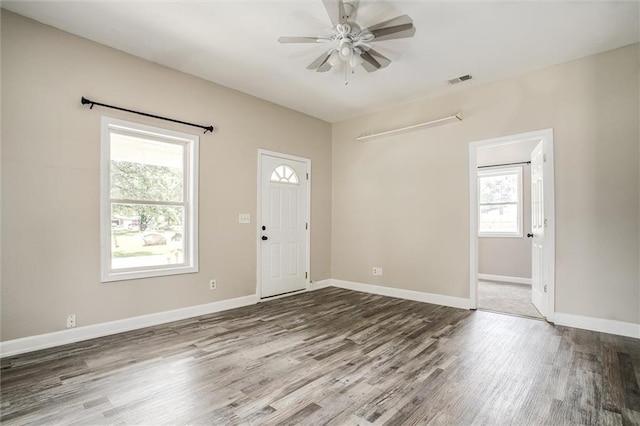 114 W 2nd St, Garden City, MO 64747 - entryway featuring wood finished floors, a ceiling fan, and baseboards