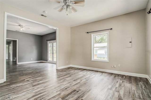 114 W 2nd St, Garden City, MO 64747 - spare room featuring a ceiling fan, wood finished floors, baseboards, and french doors