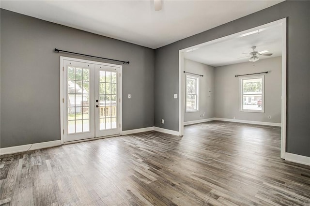 114 W 2nd St, Garden City, MO 64747 - empty room featuring french doors, a ceiling fan, wood finished floors, and baseboards