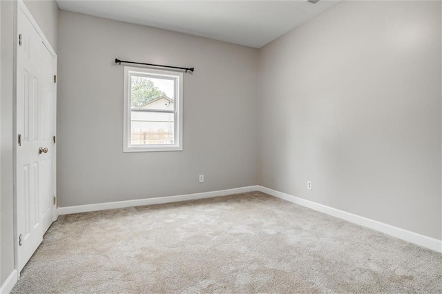 114 W 2nd St, Garden City, MO 64747 - unfurnished bedroom with carpet flooring and baseboards