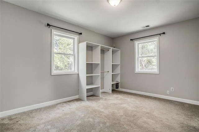 114 W 2nd St, Garden City, MO 64747 - unfurnished bedroom with carpet flooring and baseboards