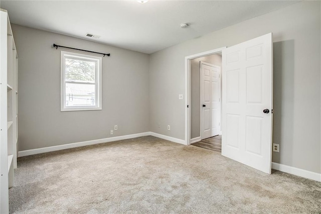 114 W 2nd St, Garden City, MO 64747 - unfurnished bedroom with carpet floors and baseboards