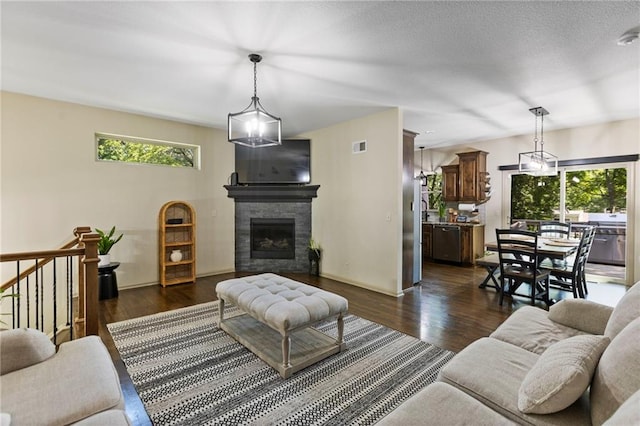 7907 W 59th Ter, Merriam, KS 66202 - living area with dark wood-style floors and a fireplace
