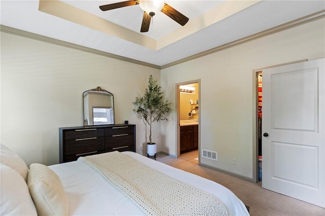 7907 W 59th Ter, Merriam, KS 66202 - bedroom featuring light colored carpet, a tray ceiling, crown molding, ensuite bathroom, and a ceiling fan