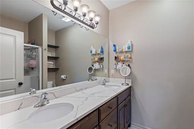 7907 W 59th Ter, Merriam, KS 66202 - full bathroom featuring double vanity and a shower with shower door