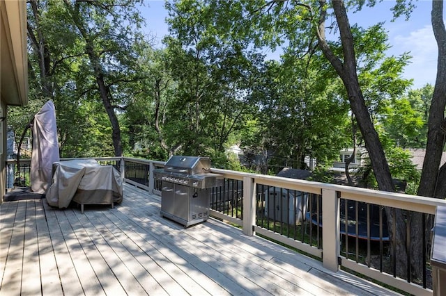 7907 W 59th Ter, Merriam, KS 66202 - wooden terrace with grilling area and view of scattered trees