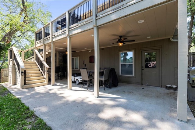 7907 W 59th Ter, Merriam, KS 66202 - view of patio / terrace with stairway, a ceiling fan, outdoor dining space, and a carport