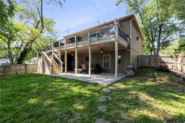 7907 W 59th Ter, Merriam, KS 66202 - rear view of house with a ceiling fan, a fenced backyard, stairs, and a patio