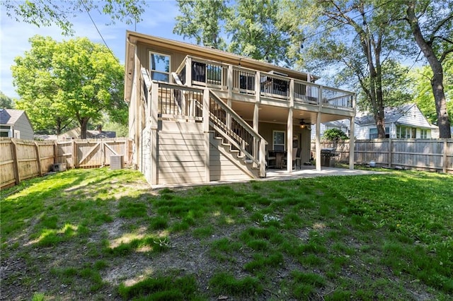 7907 W 59th Ter, Merriam, KS 66202 - back of property featuring a fenced backyard, a ceiling fan, a patio area, a gate, and a wooden deck