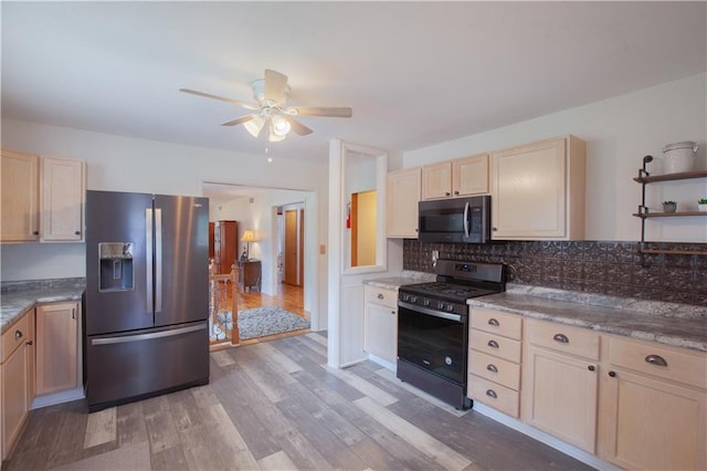 501 N Franklin St, Spring Hill, KS 66083 - kitchen featuring stainless steel appliances, light wood-type flooring, light brown cabinetry, ceiling fan, and decorative backsplash