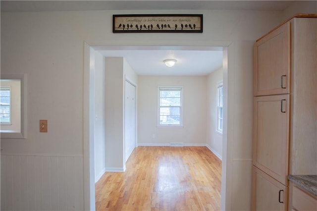 501 N Franklin St, Spring Hill, KS 66083 - corridor with light wood finished floors and wainscoting