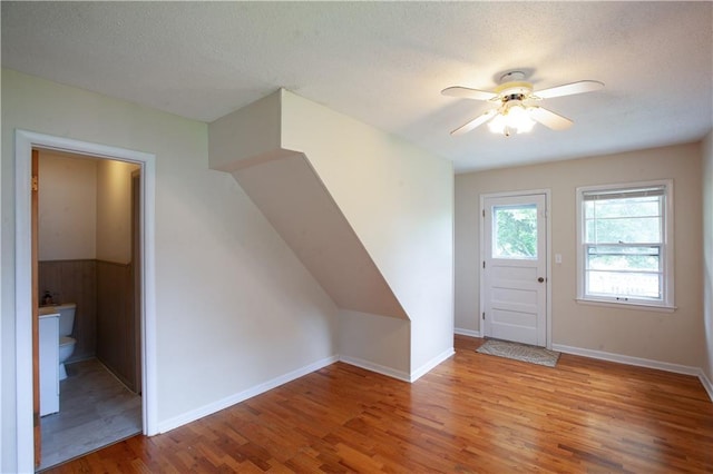 501 N Franklin St, Spring Hill, KS 66083 - foyer featuring wood finished floors, a ceiling fan, and a textured ceiling