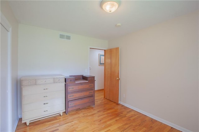 501 N Franklin St, Spring Hill, KS 66083 - unfurnished bedroom featuring light wood-style floors and baseboards