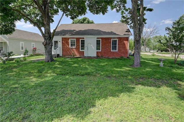 8 S Mulberry St, Louisburg, KS 66053 - ranch-style house with a front yard and brick siding