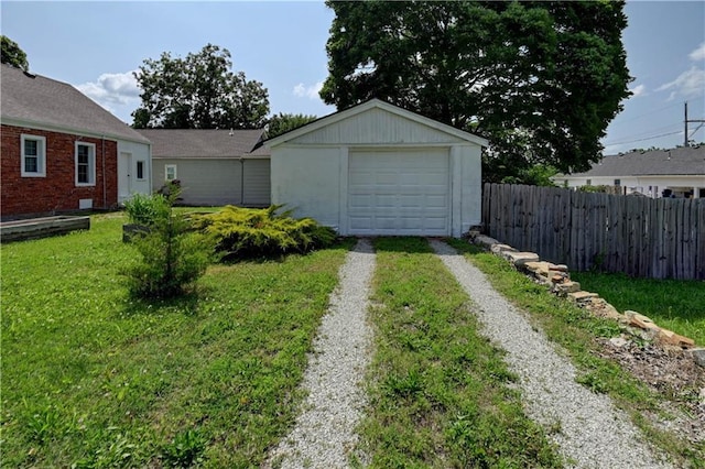 8 S Mulberry St, Louisburg, KS 66053 - view of yard with driveway, a garage, and an outbuilding