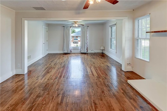 8 S Mulberry St, Louisburg, KS 66053 - empty room with a ceiling fan, healthy amount of natural light, wood finished floors, baseboards, and ornamental molding