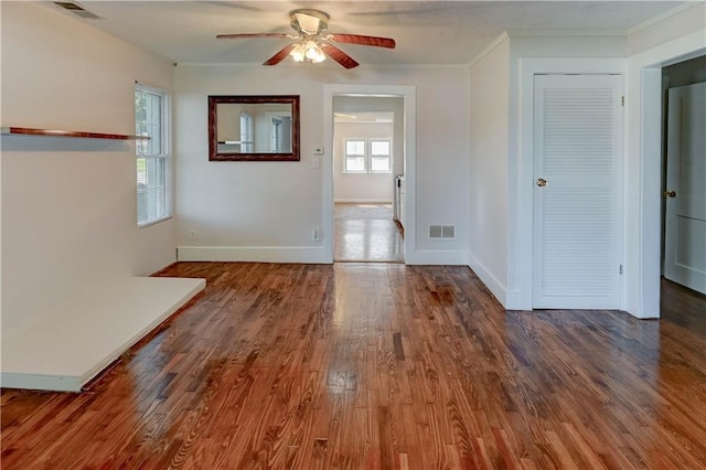 8 S Mulberry St, Louisburg, KS 66053 - spare room featuring ceiling fan, wood finished floors, baseboards, and crown molding