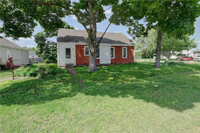 8 S Mulberry St, Louisburg, KS 66053 - view of front of property featuring a front lawn and brick siding