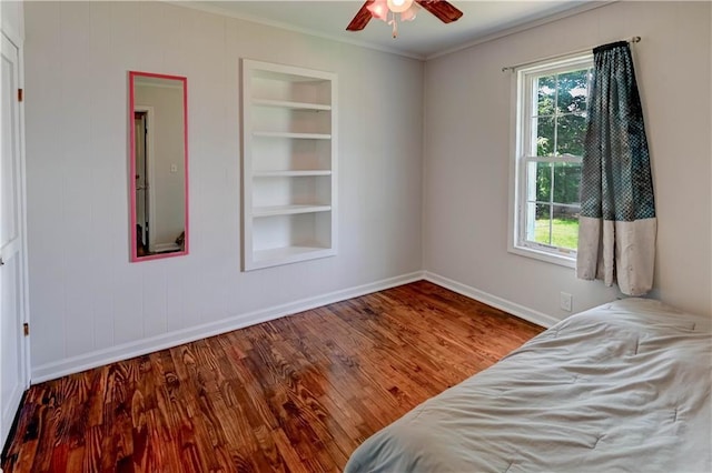 8 S Mulberry St, Louisburg, KS 66053 - bedroom with baseboards, crown molding, wood finished floors, and ceiling fan