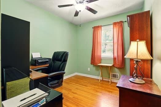 1203 S Skyline Dr, Liberty, MO 64068 - office area featuring ceiling fan and light wood-type flooring