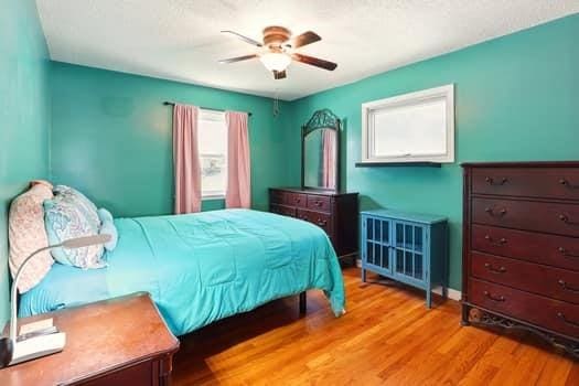 1203 S Skyline Dr, Liberty, MO 64068 - bedroom with wood finished floors and ceiling fan