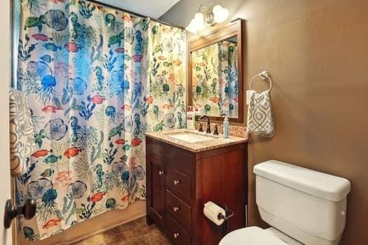 1203 S Skyline Dr, Liberty, MO 64068 - full bath featuring vanity and curtained shower
