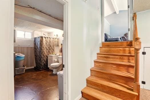 1203 S Skyline Dr, Liberty, MO 64068 - stairs featuring concrete flooring