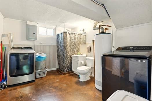 1203 S Skyline Dr, Liberty, MO 64068 - bathroom with washer / dryer, water heater, concrete floors, and electric panel