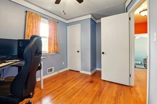 1203 S Skyline Dr, Liberty, MO 64068 - office area featuring ceiling fan and wood finished floors