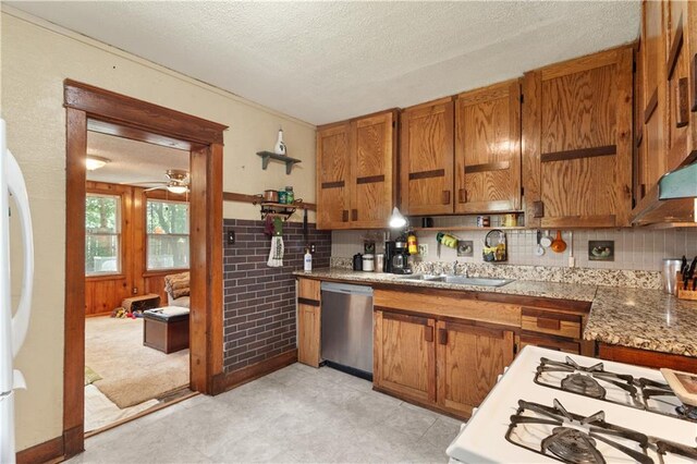 225 W Moore St, Independence, MO 64050 - kitchen featuring dishwasher, brown cabinets, a textured ceiling, ceiling fan, and fridge
