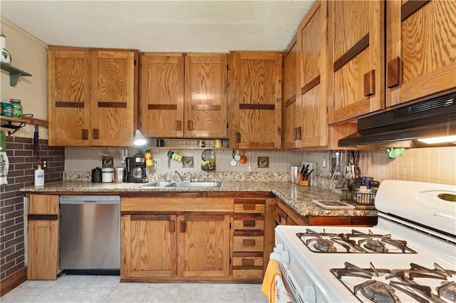 225 W Moore St, Independence, MO 64050 - kitchen with stainless steel dishwasher, white gas stove, under cabinet range hood, and brown cabinets